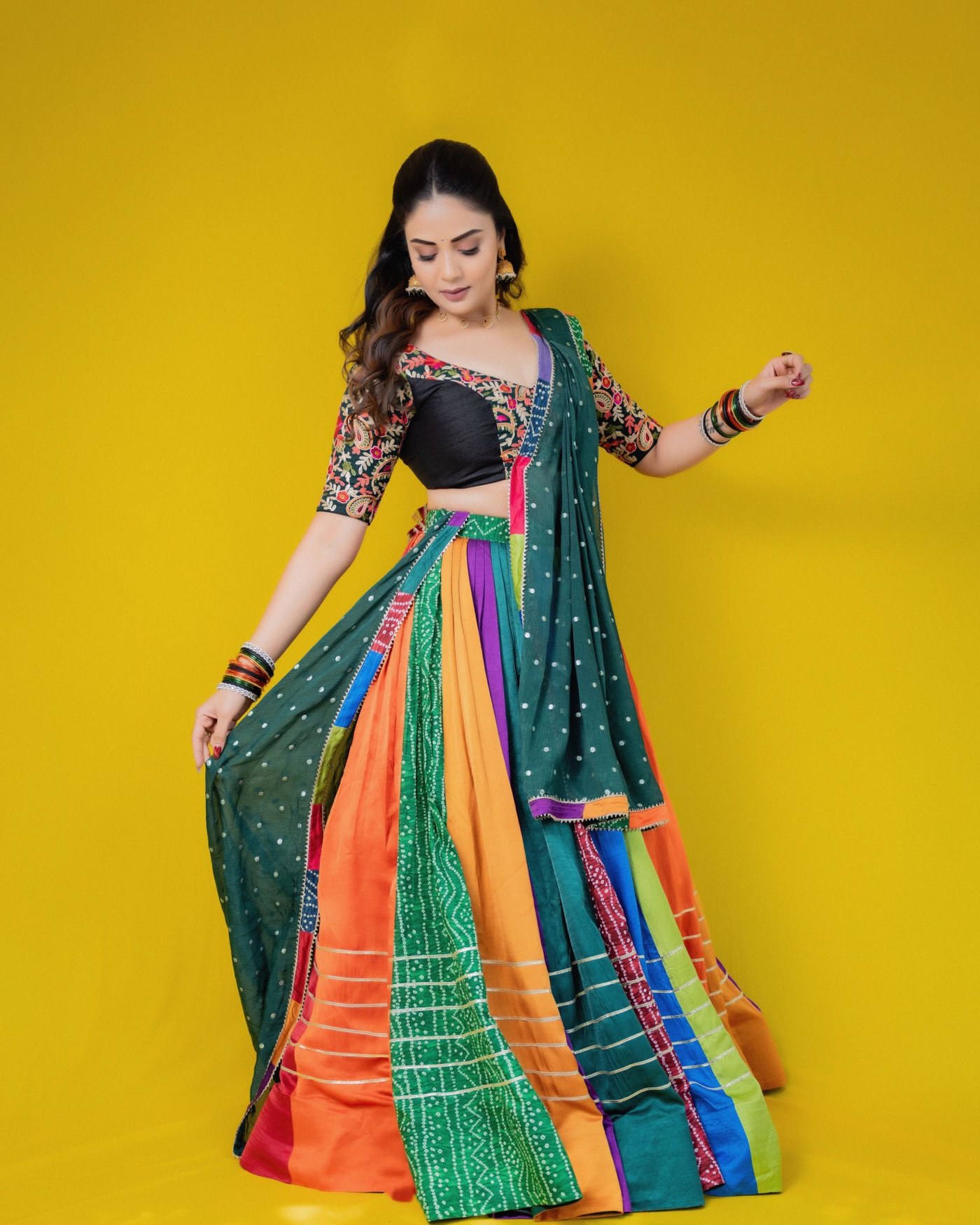 Sreemukhi showcases a vibrant, colourful sari-inspired ensemble.