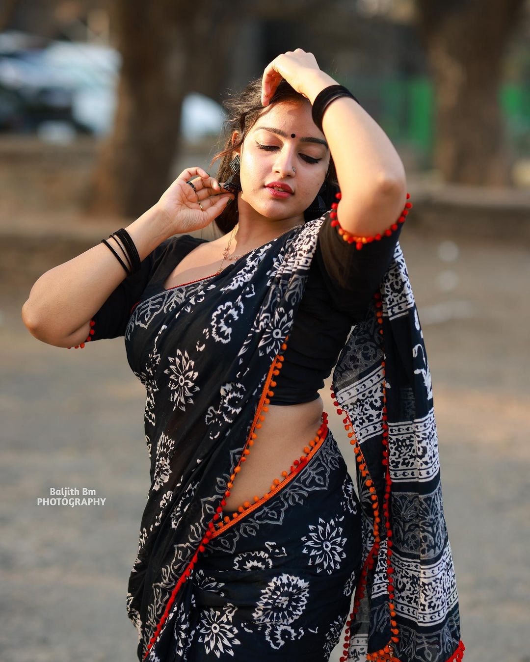 Stunning Malavika Menon in Black Saree Photos Fashion Gallery
