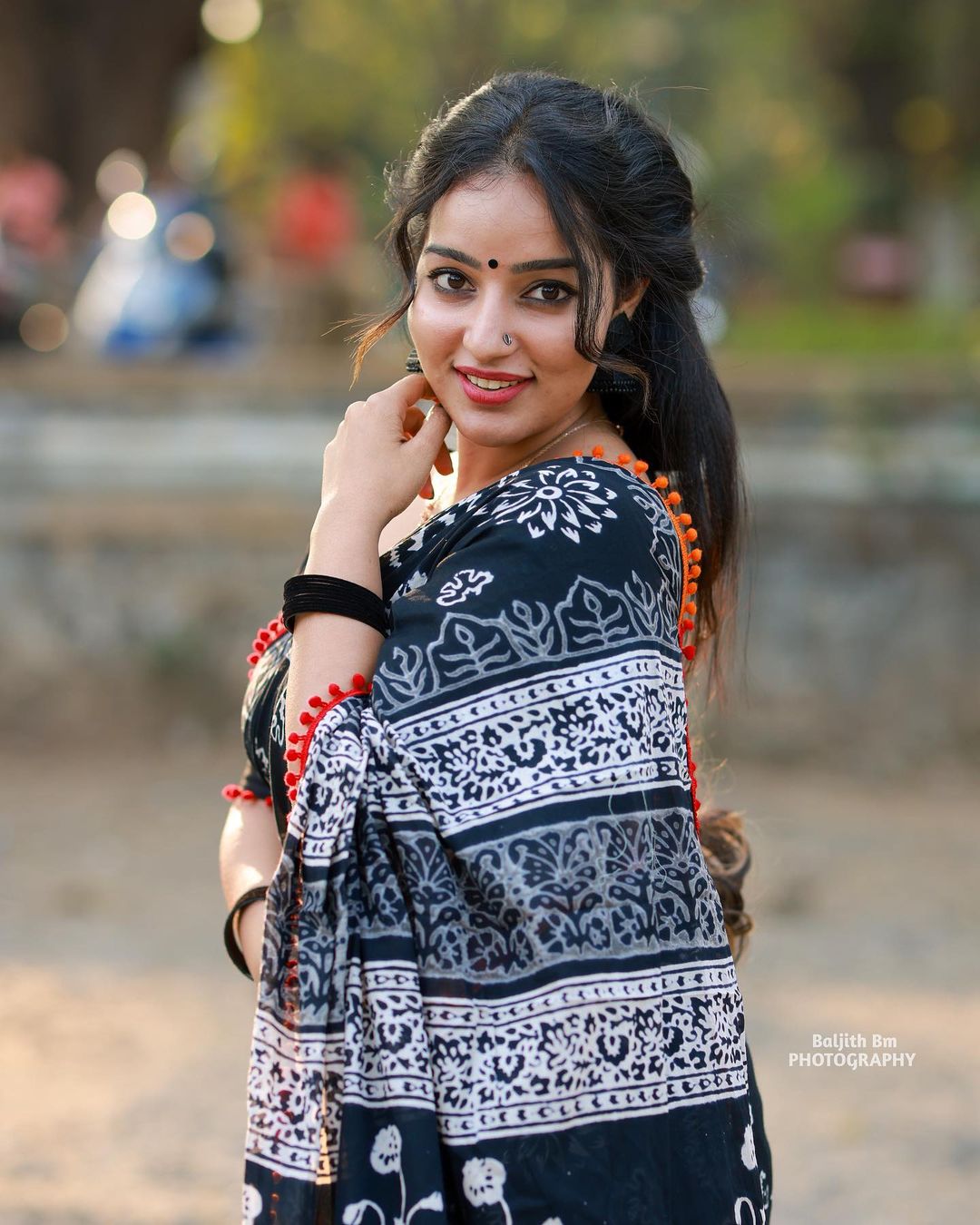 Stunning Malavika Menon in Black Saree Photos Fashion Gallery