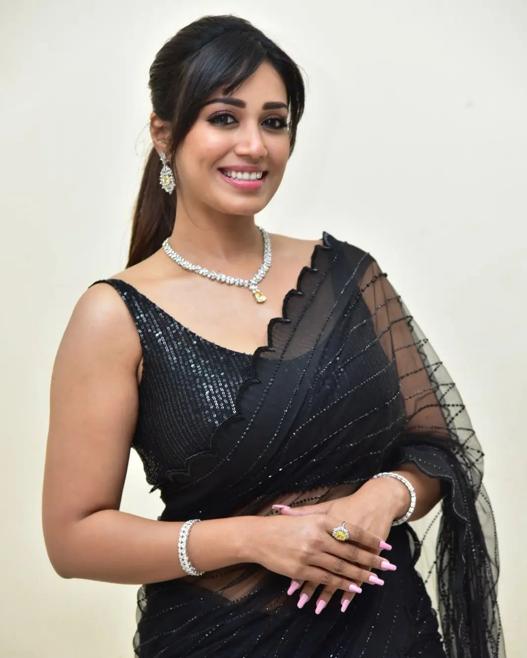 Stunning Nivetha Pethuraj in Black Saree Photos