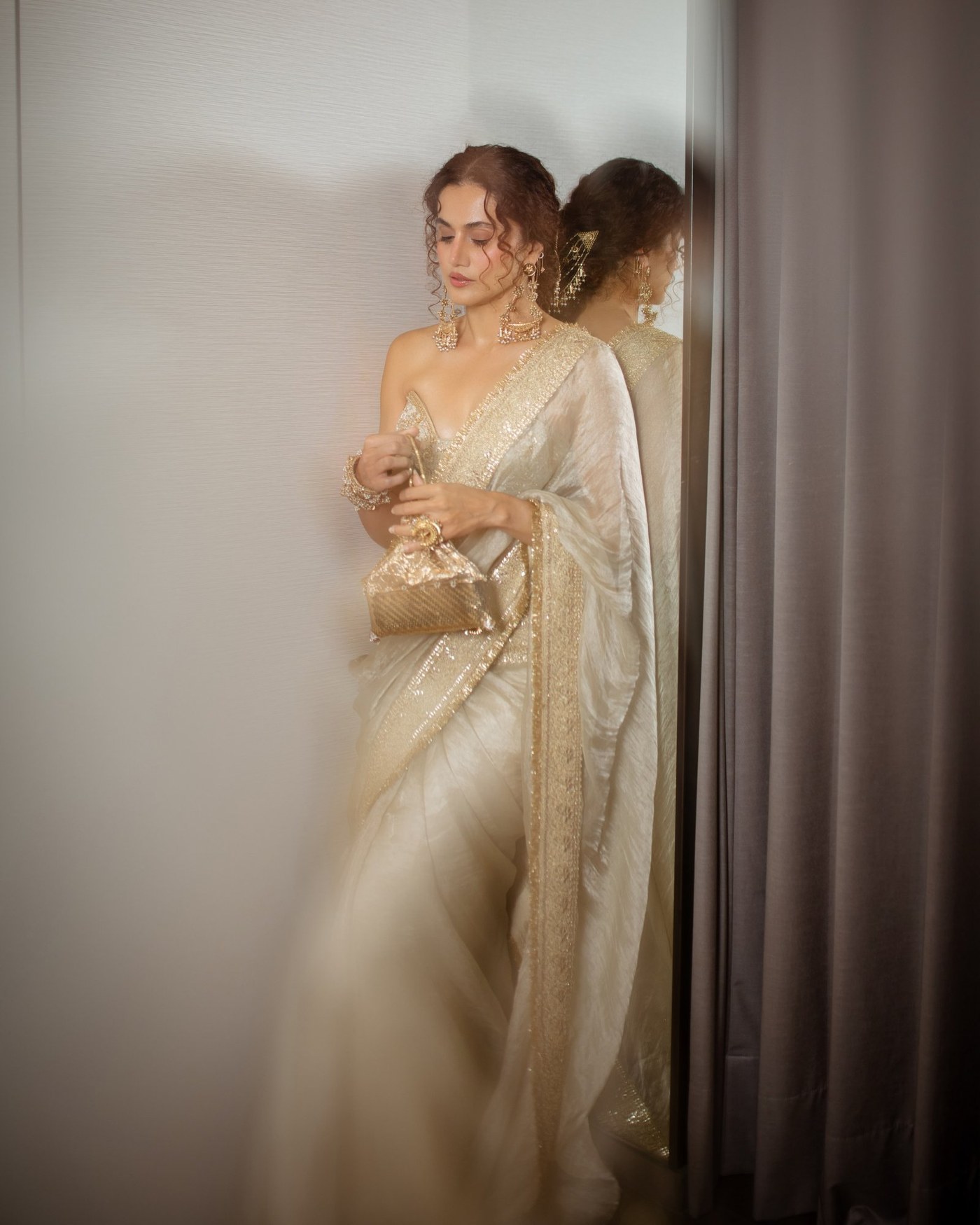Ivory and Gold: Taapsee Pannu's Structured Sari Statement