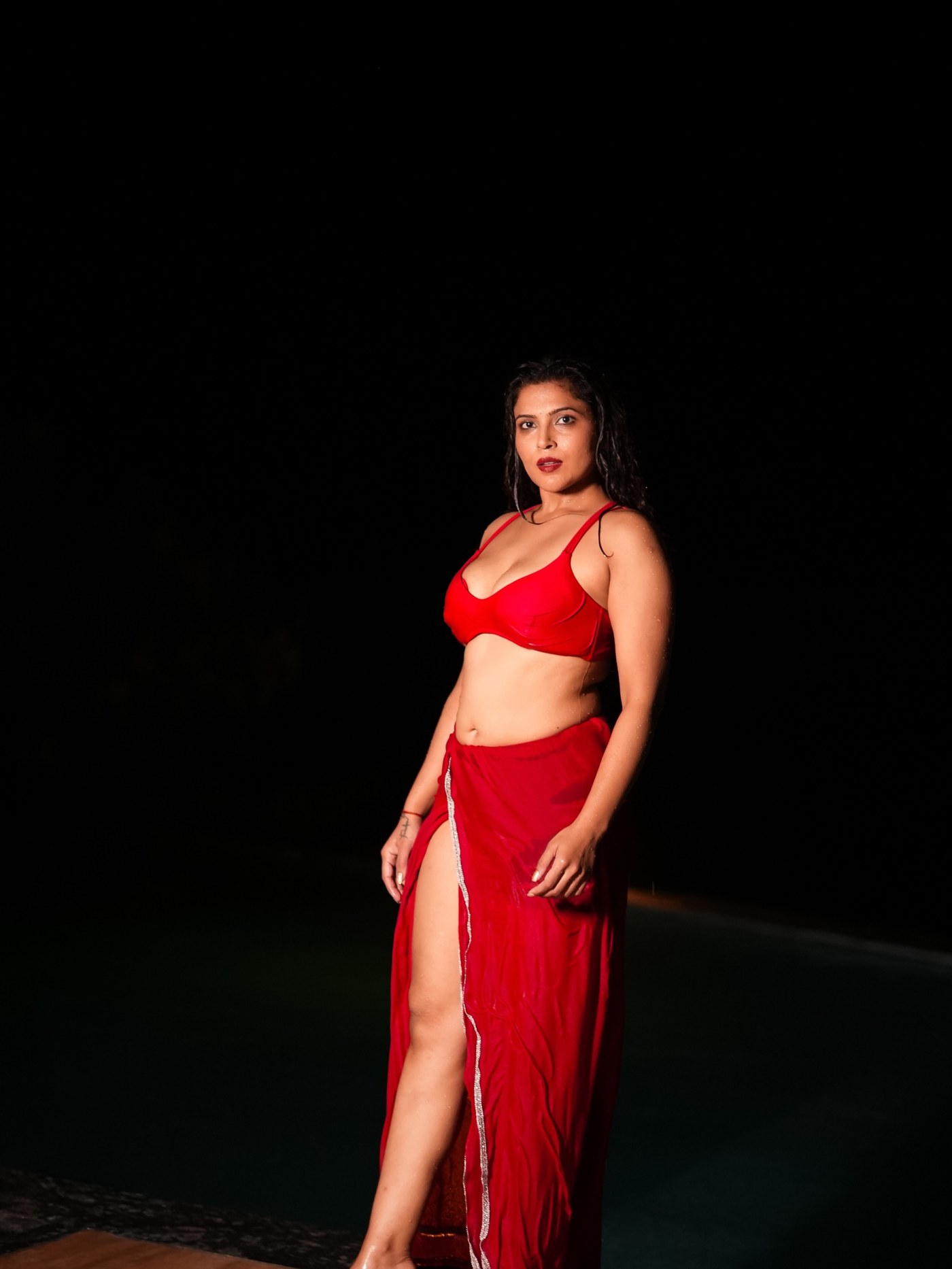 Crimson Cascade: Tanya Chaudhari's Rain-Soaked Two-Piece