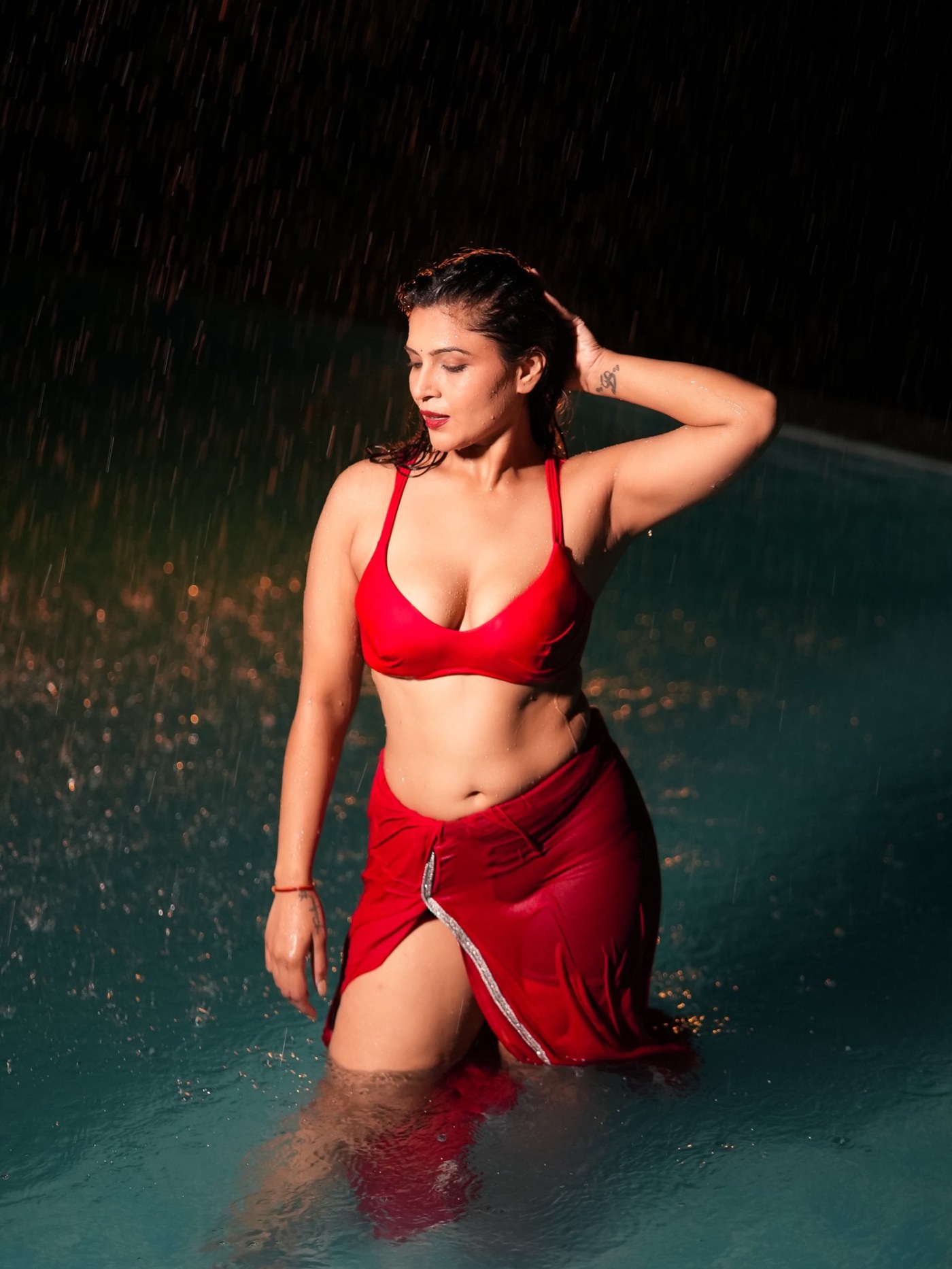 Crimson Cascade: Tanya Chaudhari's Rain-Soaked Two-Piece
