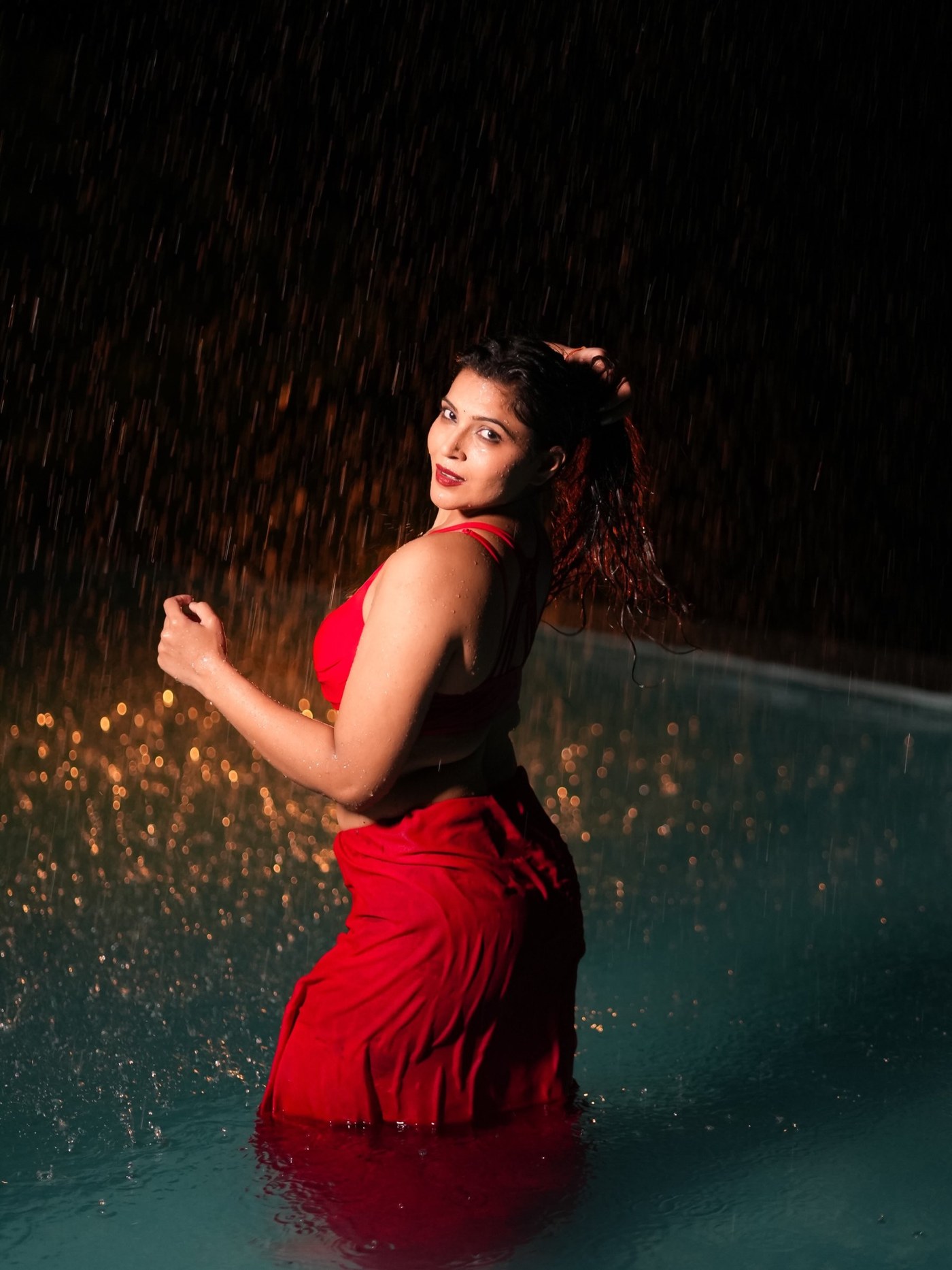 Crimson Cascade: Tanya Chaudhari's Rain-Soaked Two-Piece