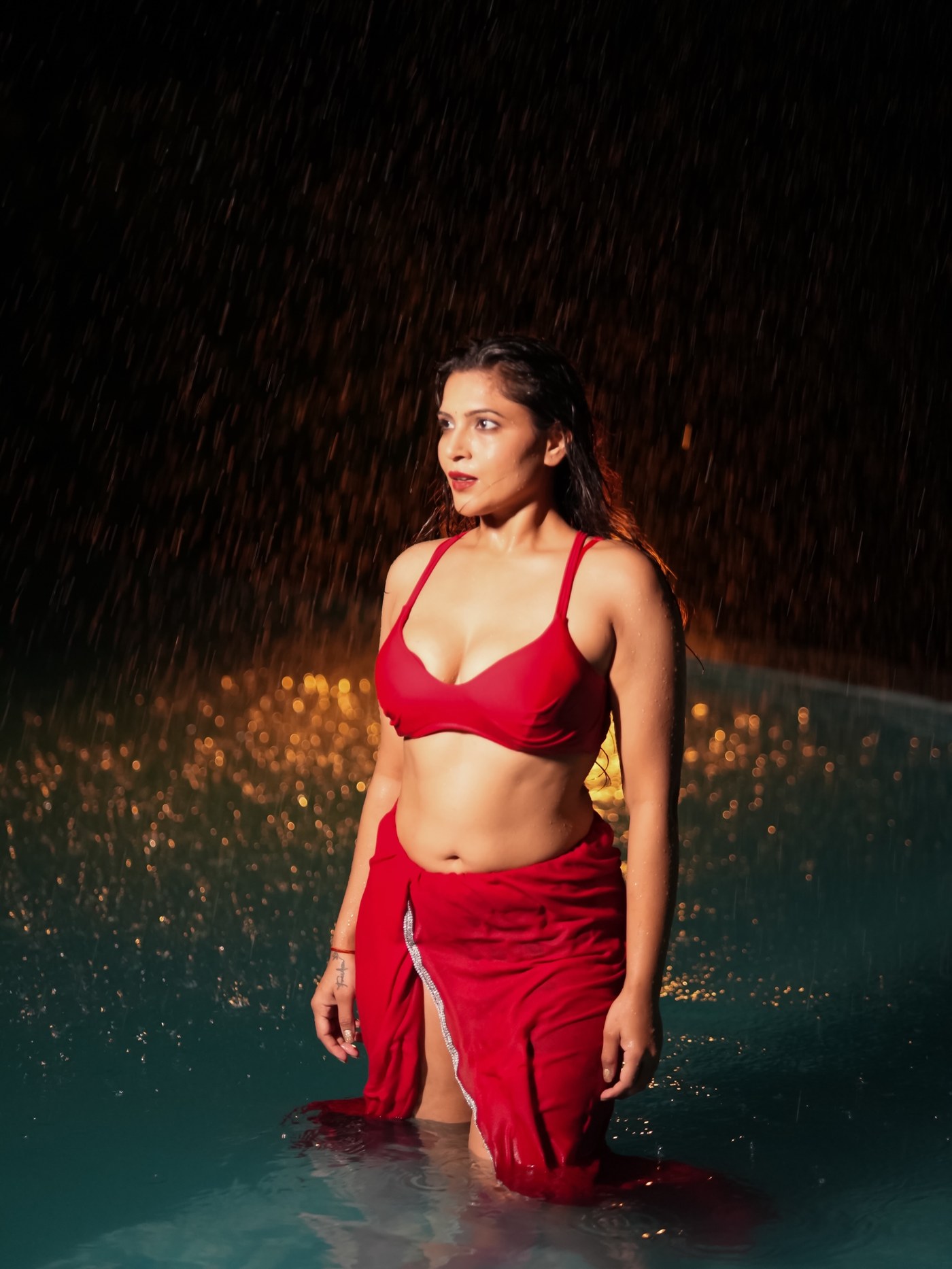 Crimson Cascade: Tanya Chaudhari's Rain-Soaked Two-Piece