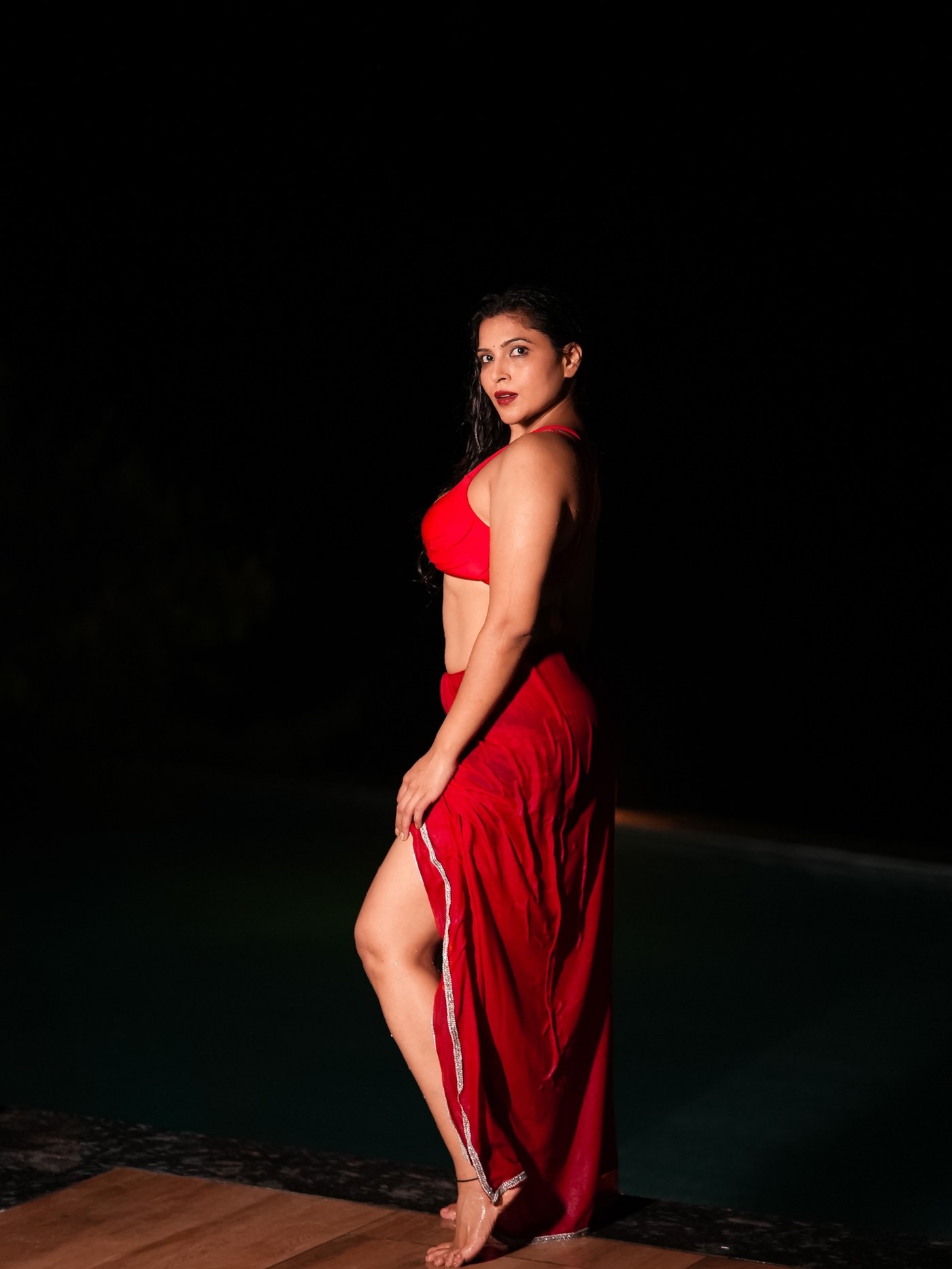 Crimson Cascade: Tanya Chaudhari's Rain-Soaked Two-Piece