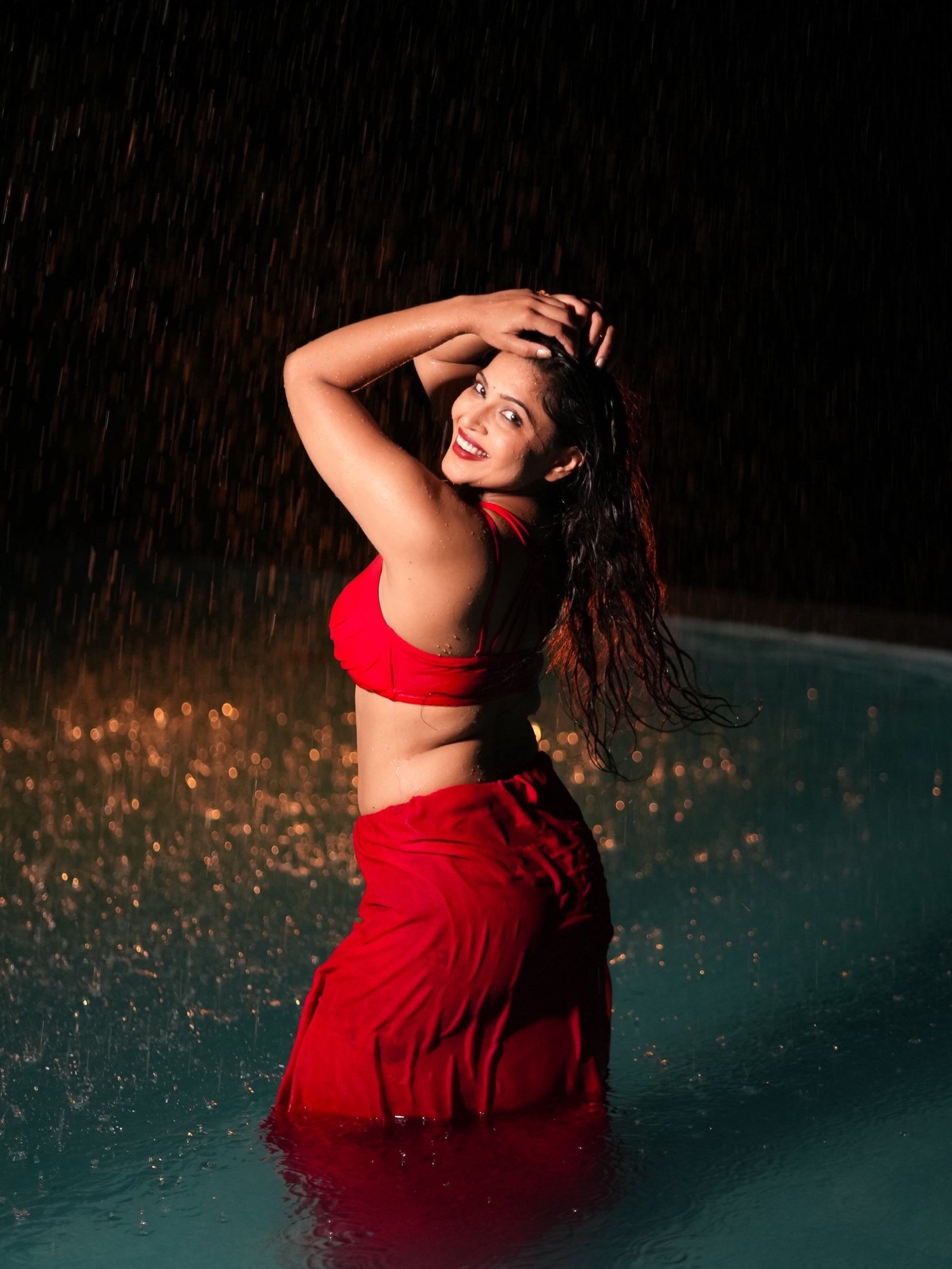 Crimson Cascade: Tanya Chaudhari's Rain-Soaked Two-Piece
