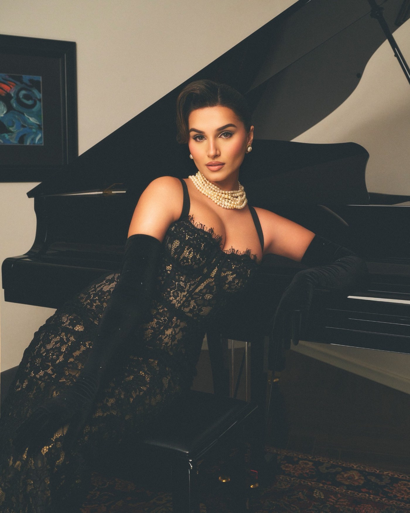 Tara Sutaria radiates timeless cinematic glamour in an intricate black lace gown and dramatic accessories. - Photos & Updates