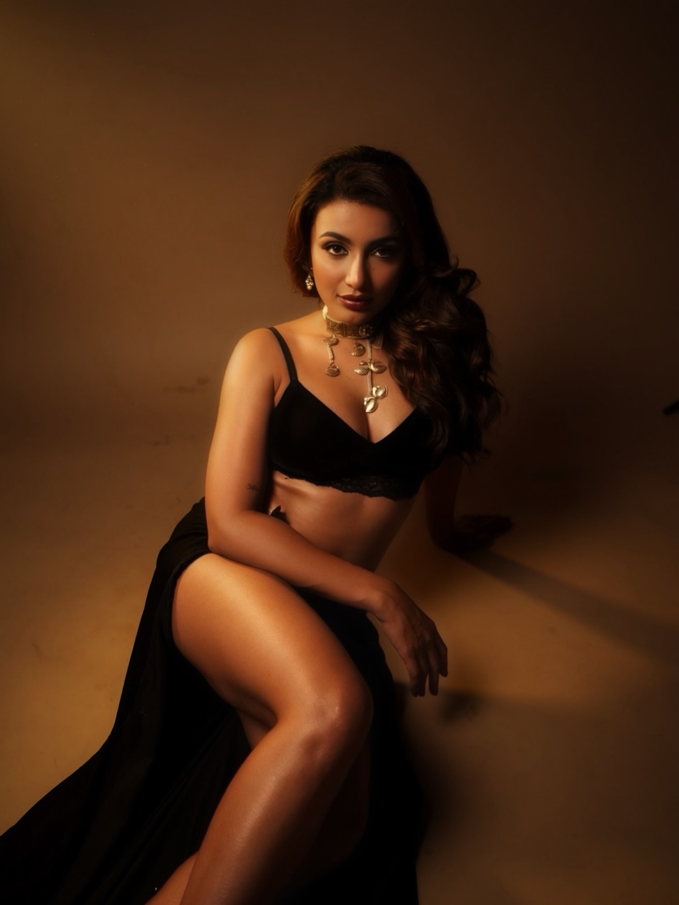 Tejaswi Madivada showcases a sleek black and gold ensemble with a dramatic fluid skirt. - Photos & Updates