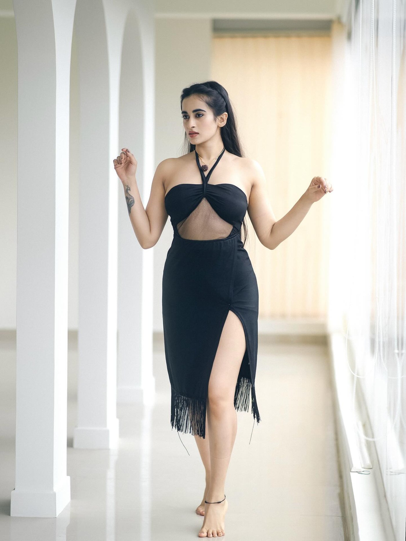 Thapaswini Poonacha showcases sophisticated black fashion looks, radiating confidence and contemporary style. - Photos & Updates