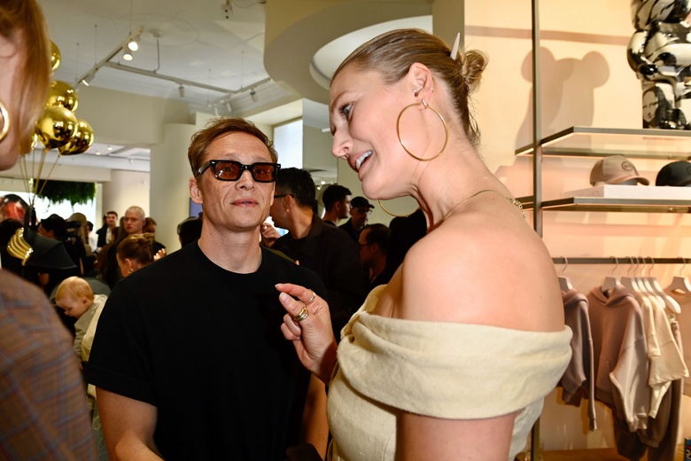 Toni Garrn posing elegantly at a high-fashion event, showcasing a striking outfit.