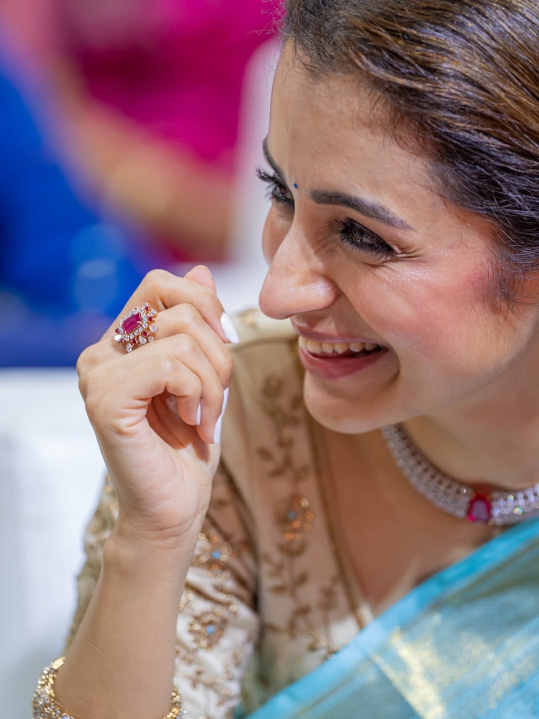 Trisha in traditional attire adorned with floral garlands and elaborate jewelry.