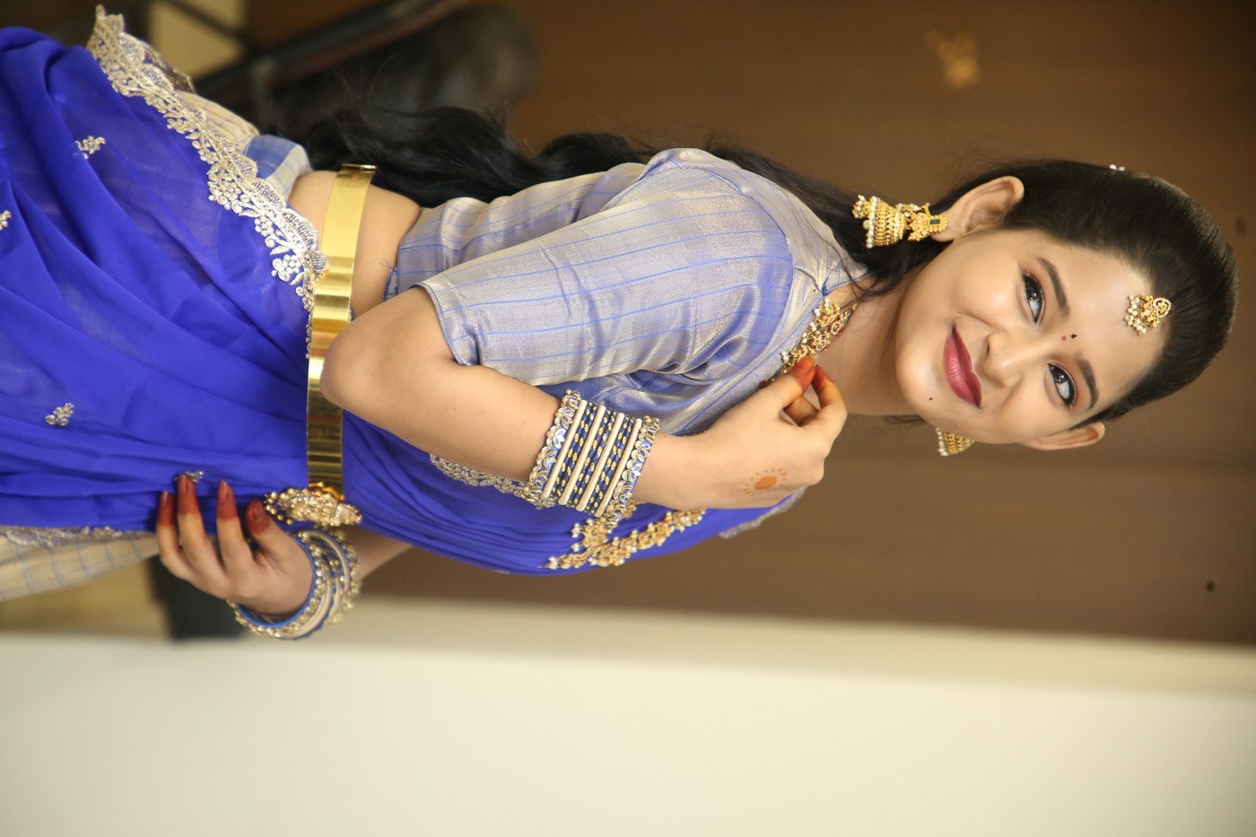 Vasavi Ganeshan radiates classic beauty in an ornate royal blue saree ensemble. - Photos & Updates