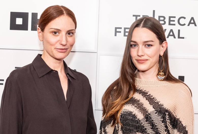Victoria Pedretti posing elegantly at a formal event, showcasing a glamorous ensemble.