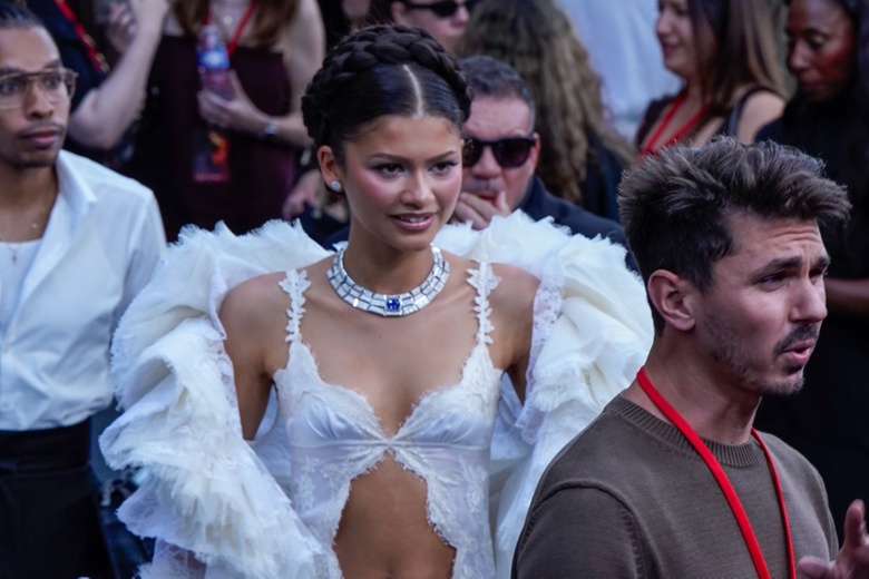 Zendaya shines brightly at a premiere event in Paris, looking glamorous and poised.